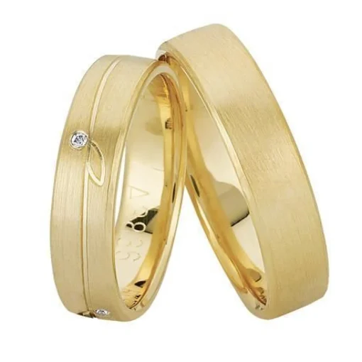 Nuran - Trauringe aus 8-14kt. Rotgold mit 1 Brillant im Damenring